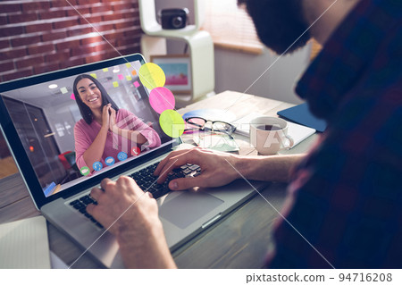 Caucasian businessman sitting at desk using laptop having video call with female colleague 94716208