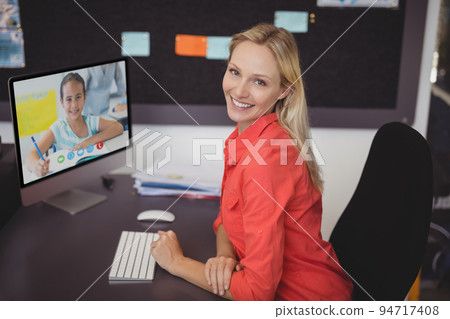 Portrait of happy caucasian female teacher using computer on video call with schoolgirl Portrait of happy caucasian female teacher using computer on video call with schoolgirl 94717408