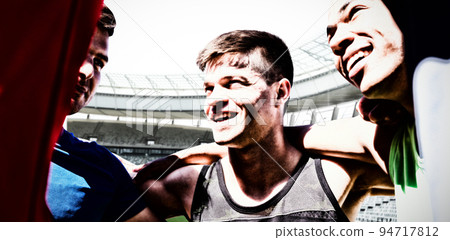 Composite image of sportsmen with arms around each other 94717812