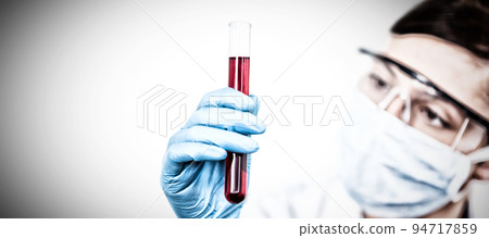 Female scientist conducting an experiment. Testing for Coronavirus pandemic Female scientist conducting an experiment. Testing for Coronavirus pandemic 94717859