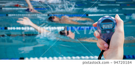 Composite image of close-up of a woman holding a chronometer to measure performance Composite image of close-up of a woman holding a chronometer to measure performance 94720184