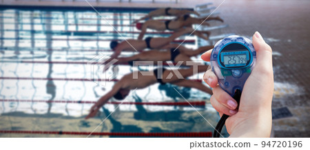 Composite image of close-up of a woman holding a chronometer to measure performance 94720196