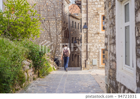 The man in Ulcinj town in Montenegro. Clock Tower of Ulcinj Sahat Kulla. Lami Mosque. Ulcinj is a popular tourist destination in the summer on the southern Adriatic coast of Montenegro. Ulqin The man in Ulcinj town in Montenegro. Clock Tower of Ulcinj Sahat Kulla. Lami Mosque. Ulcinj is a popular tourist destination in the summer on the southern Adriatic coast of Montenegro. Ulqin 94721031
