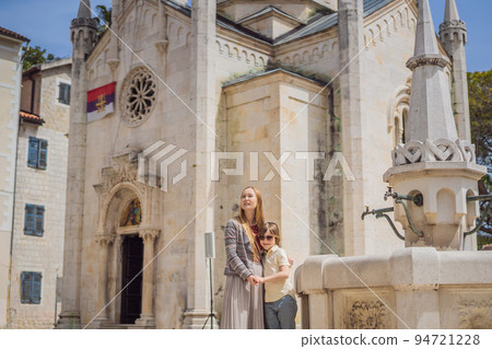Mom and son tourists in Herceg Novi old town. Historical and touristic center of Herceg Novi. Montenegro 94721228