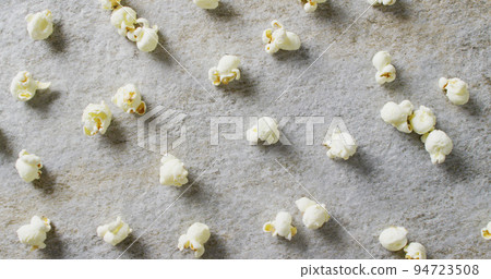 Image of close up of popcorn on gray background Image of close up of popcorn on gray background 94723508