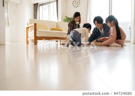 Family image playing in my home living room 94724080