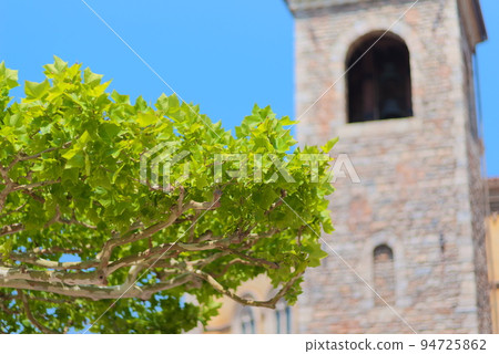 Western-style tower and sycamore Western-style tower and sycamore 94725862