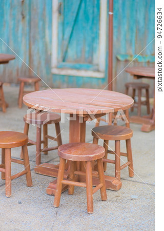 Round tables and round chairs outside the cafe Round tables and round chairs outside the cafe 94726634