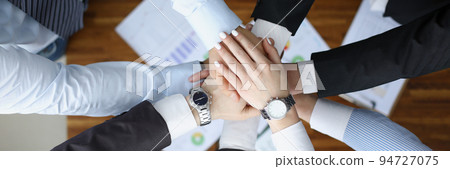 Colleagues performing gesture in order to prepare for important profitable project 94727075