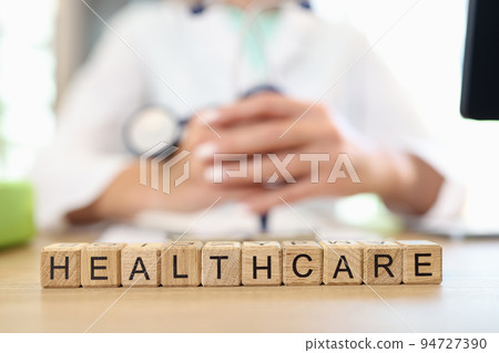 Doctor holding stethoscope information with medical and health care text 94727390