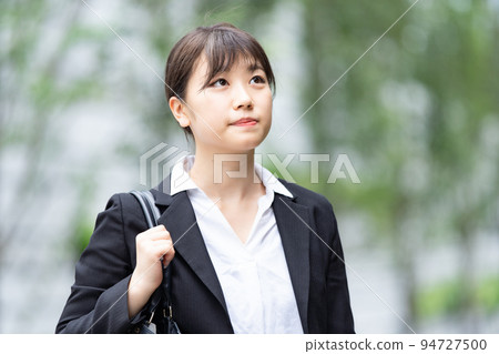 A young lady in a suit 94727500
