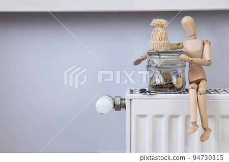 Concept of payment for heating, heating season, space for text Concept of payment for heating, heating season, space for text 94730315