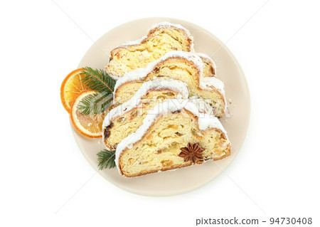 Stollen, tasty German dessert, isolated on white background Stollen, tasty German dessert, isolated on white background 94730408