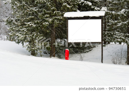 Empty poster in forest at winter. blank mockup advertising banner in ski resort Empty poster in forest at winter. blank mockup advertising banner in ski resort 94730651