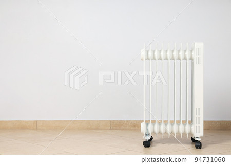 Concept of heating season, modern electric heater in room 94731060
