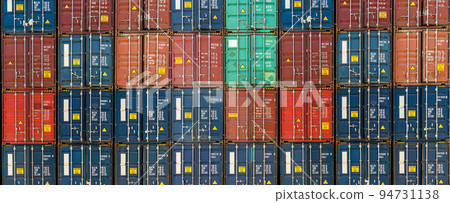 Stack of containers in a harbor. Shipping containers stacked on cargo ship. Stack of containers in a harbor. Shipping containers stacked on cargo ship. 94731138