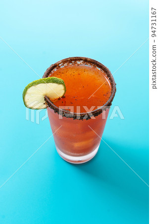 Homemade michelada cocktail with beer, lime juice,hot sauce,salted Rim and tomato juice Homemade michelada cocktail with beer, lime juice,hot sauce,salted Rim and tomato juice 94731167