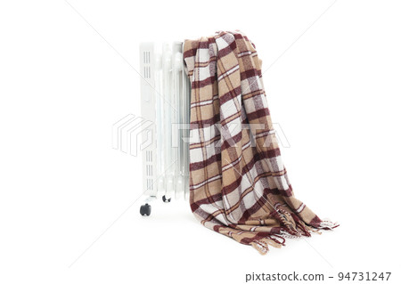 Electric heater with plaid isolated on white background Electric heater with plaid isolated on white background 94731247
