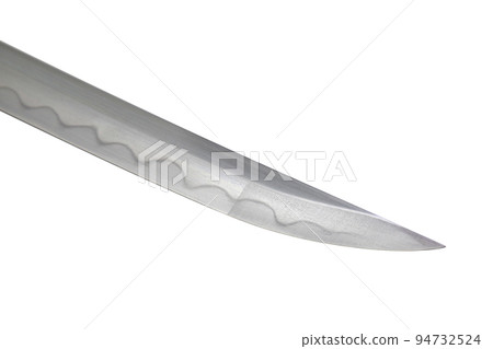 Japanese sword blade on white background. Soft focus. The wavy pattern on the blade edge is a line of hardness that a blacksmith makes so that the blade doesn't break. Each piece is unique. Japanese sword blade on white background. Soft focus. The wavy pattern on the blade edge is a line of hardness that a blacksmith makes so that the blade doesn't break. Each piece is unique. 94732524