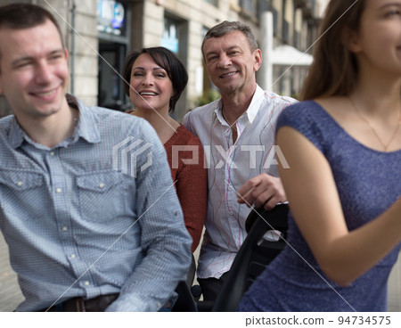 family of tourists enjoy a walk on the bike carriage family of tourists enjoy a walk on the bike carriage 94734575