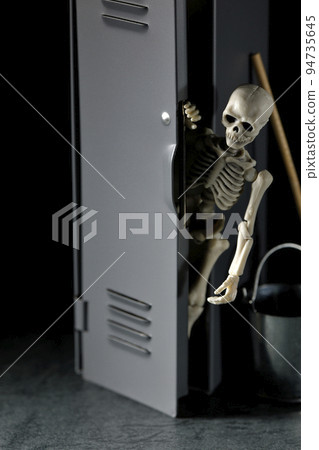 A skeleton coming out of a cleaning locker 94735645