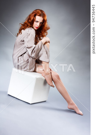 Long Curly Red Hair. Fashion Woman Portrait. Beauty Model Girl with Luxurious Hair, Make up and Accessories. Hairstyle. Wavy Hair Extensions Concept. Holiday Makeup. Smoky eyes and Red lipstick Long Curly Red Hair. Fashion Woman Portrait. Beauty Model Girl with Luxurious Hair, Make up and Accessories. Hairstyle. Wavy Hair Extensions Concept. Holiday Makeup. Smoky eyes and Red lipstick 94736445
