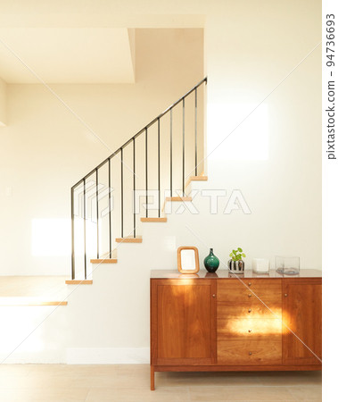 Stylish stairs and cabinets in the living room House interior image Stylish stairs and cabinets in the living room House interior image 94736693