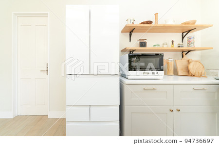 Kitchen interior image with a large refrigerator 94736697