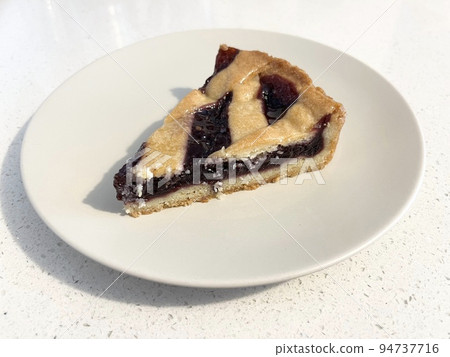 Crostata (mixed berry jam), a traditional Italian tart Crostata (mixed berry jam), a traditional Italian tart 94737716