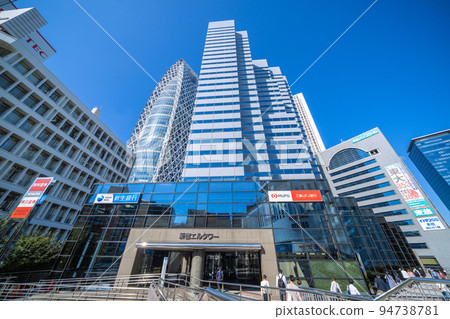 Tokyo cityscape in Japan Shinjuku subcenter. Overlooking Shinjuku L Tower and Tokyo Mode Gakuen Cocoon Tower 94738781