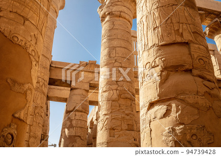 Different hieroglyphs on the walls and columns in the Karnak temple. Karnak temple is the largest complex in ancient Egypt. Different hieroglyphs on the walls and columns in the Karnak temple. Karnak temple is the largest complex in ancient Egypt. 94739428
