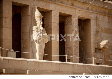 View of Hatshepsut's temple. Mortuary temple of the pharaoh of the Hatshepsut dynasty. Jeser-Jeseru is a masterpiece of ancient Egyptian architecture. Statues of ancient Egyptian pharaohs and gods. 94739436
