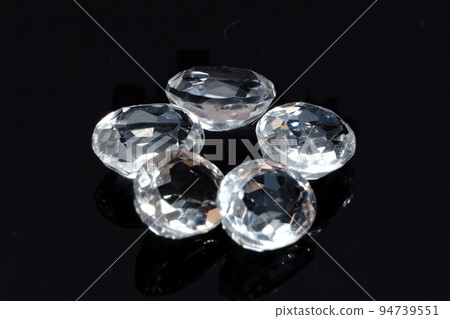 Natural gemstone white topaz on black background 94739551