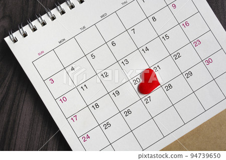 Red heart shape on the date of the 20th day in the calendar. Red heart shape on the date of the 20th day in the calendar. 94739650
