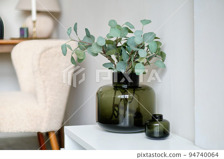 Decorative vase with artificial plants in the interior 94740064