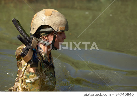 Special forces soldier with weapon take part in military maneuver. War, army, technology and people concept 94740940