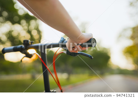 spring is comming concept with closeup woman hand hold on bicycle spring is comming concept with closeup woman hand hold on bicycle 94741321