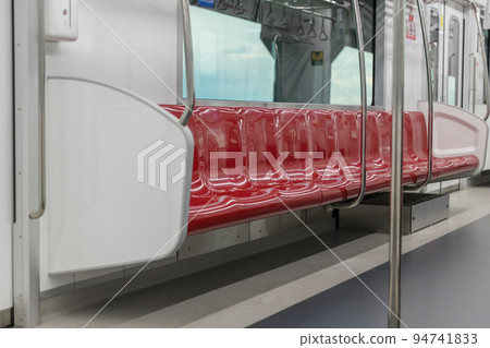 Empty seats commuter with Red color interior inside in the subway train. Empty seats commuter with Red color interior inside in the subway train. 94741833