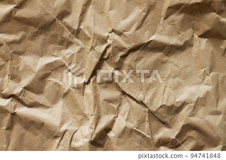 Crumpled old craft paper background texture Crumpled old craft paper background texture 94741848