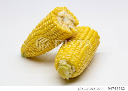 Two halves ear of ripe sweet corn isolated on white background. Isolated. Package design element. Sweet corn without husk. Close-up Two halves ear of ripe sweet corn isolated on white background. Isolated. Package design element. Sweet corn without husk. Close-up 94742382