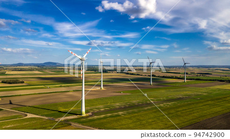 Wind Farm With Wind Turbines In Agricultural Landscape in Austria Wind Farm With Wind Turbines In Agricultural Landscape in Austria 94742900