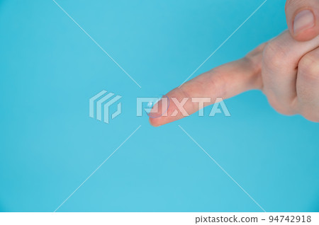 Woman holding contact lens on blue background.  94742918
