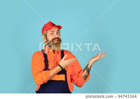 Repair advertisement. Builder or plasterer. mature repairman in uniform. foreman wear boilersuit. Laborer in working clothes. builder in working overalls. Engineer and industrial building. copy space Repair advertisement. Builder or plasterer. mature repairman in uniform. foreman wear boilersuit. Laborer in working clothes. builder in working overalls. Engineer and industrial building. copy space 94743164