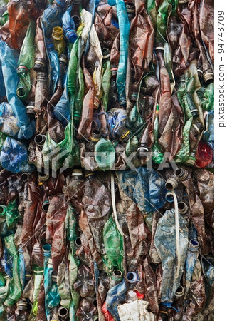 Plastic bottles in bales for waste recycling Plastic bottles in bales for waste recycling 94743709
