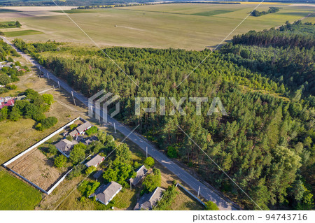 Drone view over summer agricultural fields landscape, Ukraine. Drone view over summer agricultural fields landscape, Ukraine. 94743716