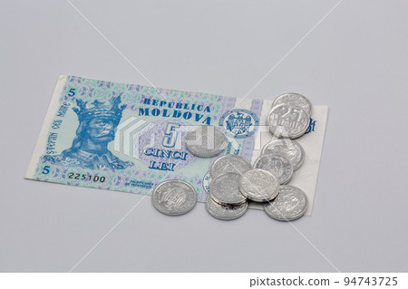 coins and paper money of Moldova closeup on white 94743725