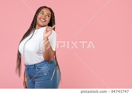 Pretty African American Obese Woman Pointing Finger Aside, Pink Background 94743747
