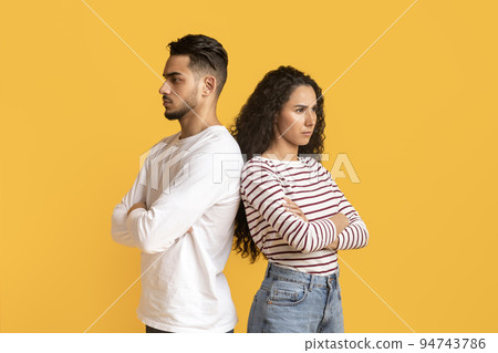 Relationship Crisis. Offended Arabic Couple Standing Back To Back, Ignoring Each Other Relationship Crisis. Offended Arabic Couple Standing Back To Back, Ignoring Each Other 94743786