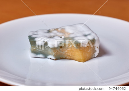 Piece old chees rotten with mold Piece old chees rotten with mold 94744062