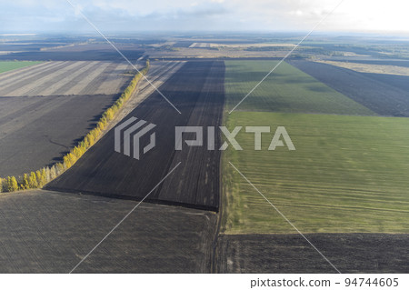 agricultural fields plowed view from a height, drone's point 94744605